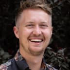Colton Pond, CMO of LoanPro in a floral shirt