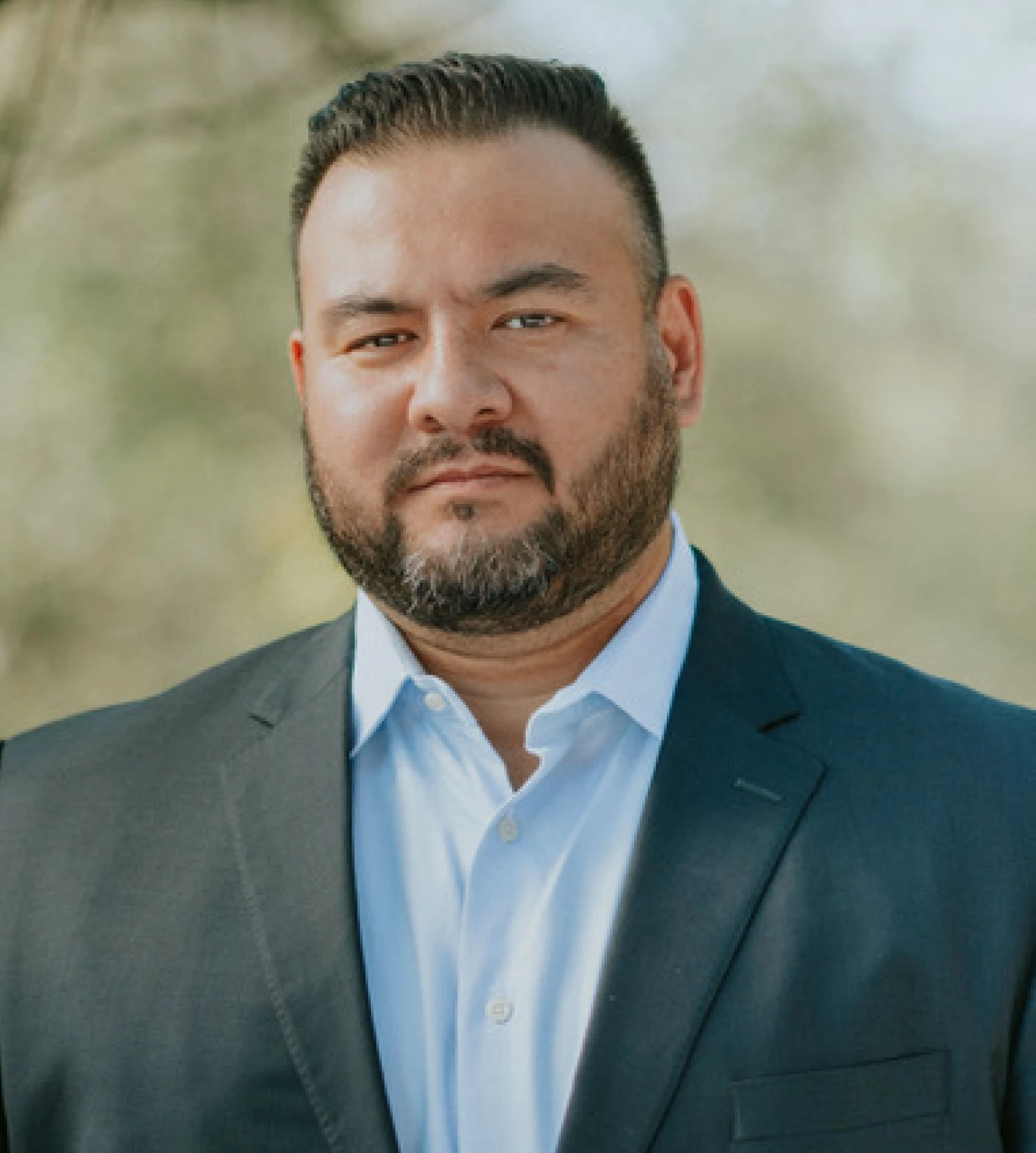 Ian Bradley, head of operations and technology at Breakout Finance, standing in a suit outdoors