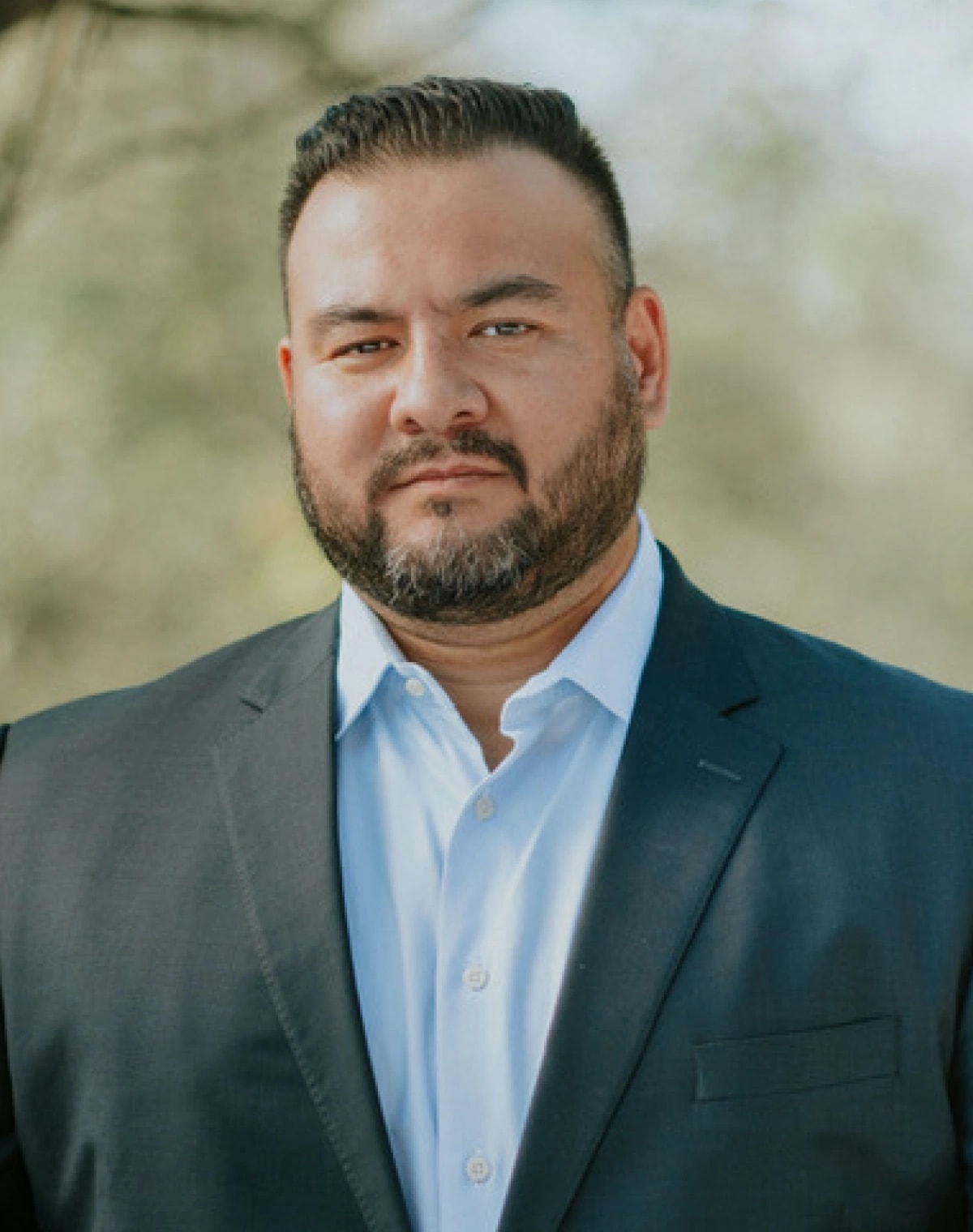 Ian Bradley, head of operations and technology at Breakout Finance, standing in a suit outdoors